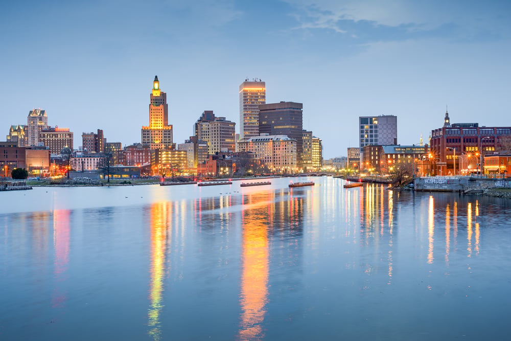 Providence, Rhode Island, USA city skyline on the Providence River at twilight.